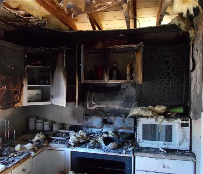 Fire damage in a kitchen with burnt items