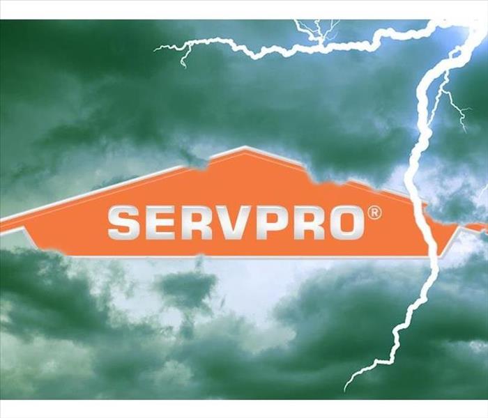 SERVPRO logo on a backdrop of stormy clouds.